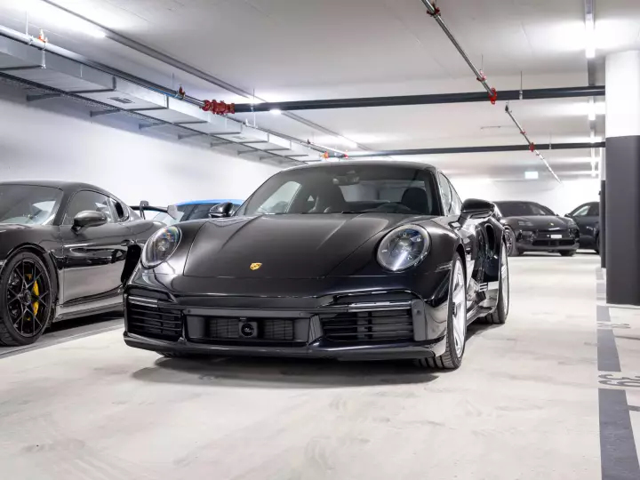 Porsche 911 Turbo 50 Years Edition (992) painted in Jet Black Metallic