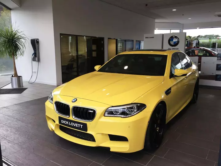 BMW M5 (F10) painted in Dakar Yellow II