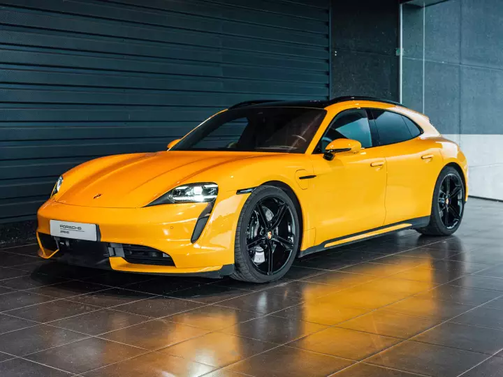 Porsche Taycan Sport Turismo painted in Signal Yellow