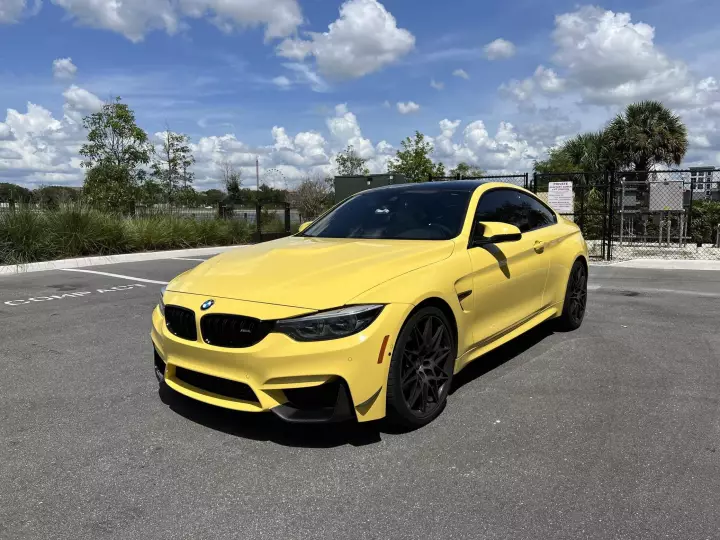 BMW M4 (F82) painted in Dakar Yellow II