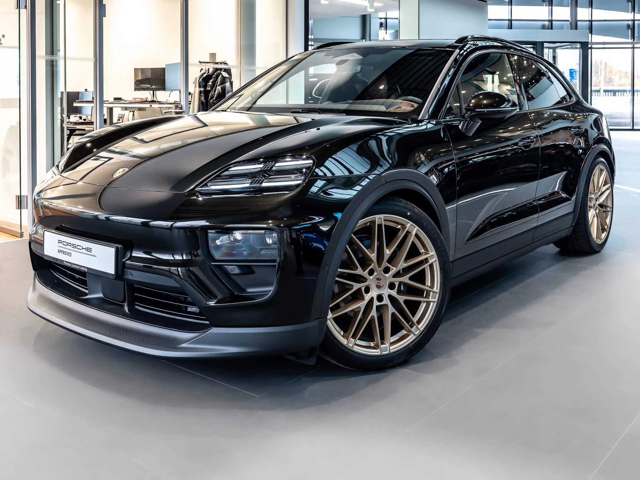 Dark Olive Metallic Porsche Macan Electric