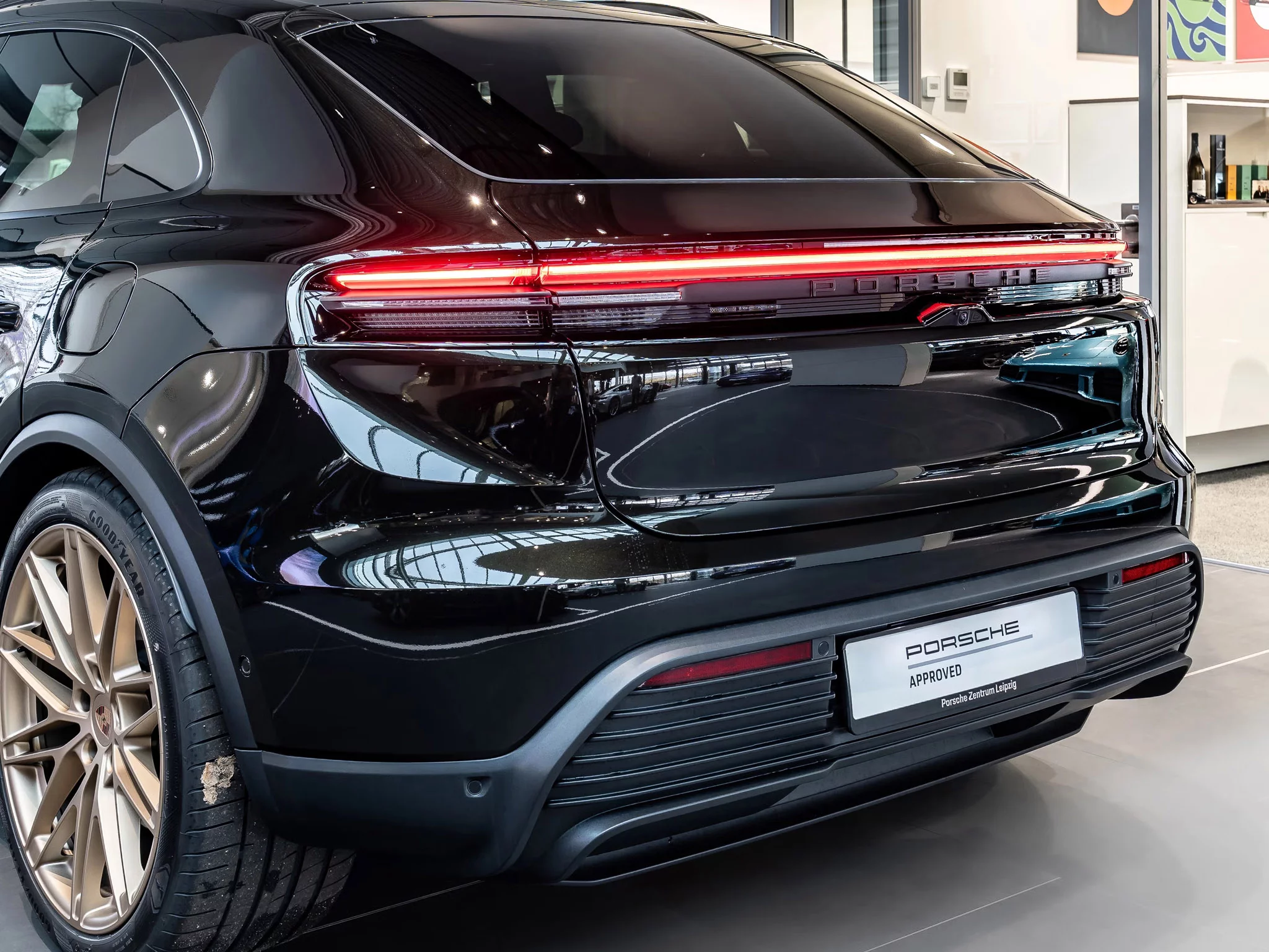 Dark Olive Metallic Porsche Macan Electric