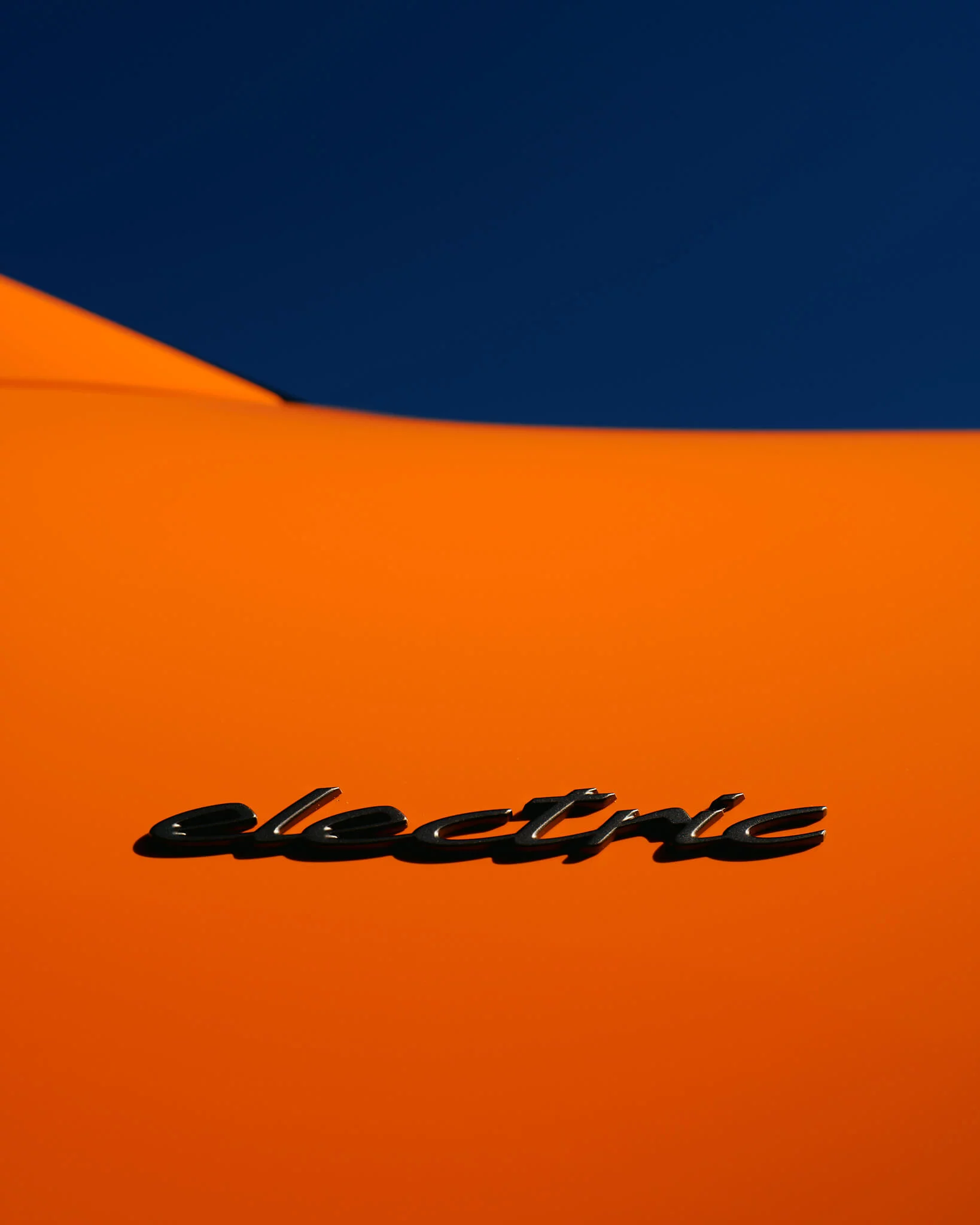 Gulf Orange Porsche Macan Electric