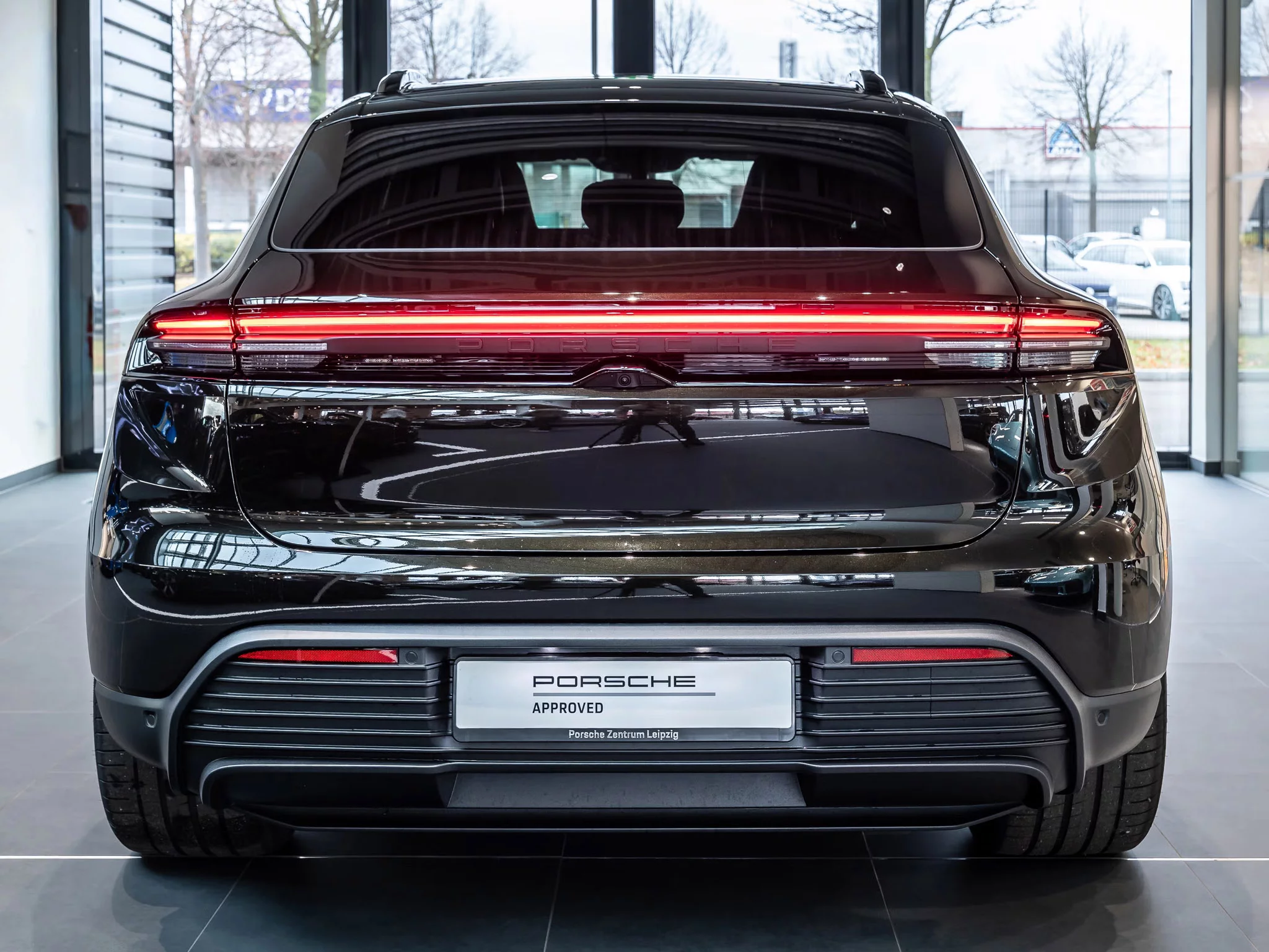 Dark Olive Metallic Porsche Macan Electric