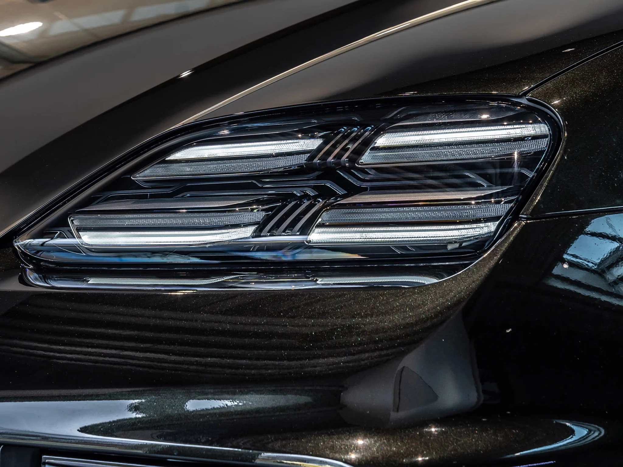 Dark Olive Metallic Porsche Macan Electric