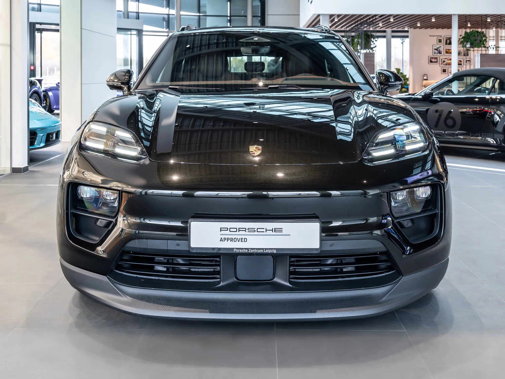 Dark Olive Metallic Porsche Macan Electric
