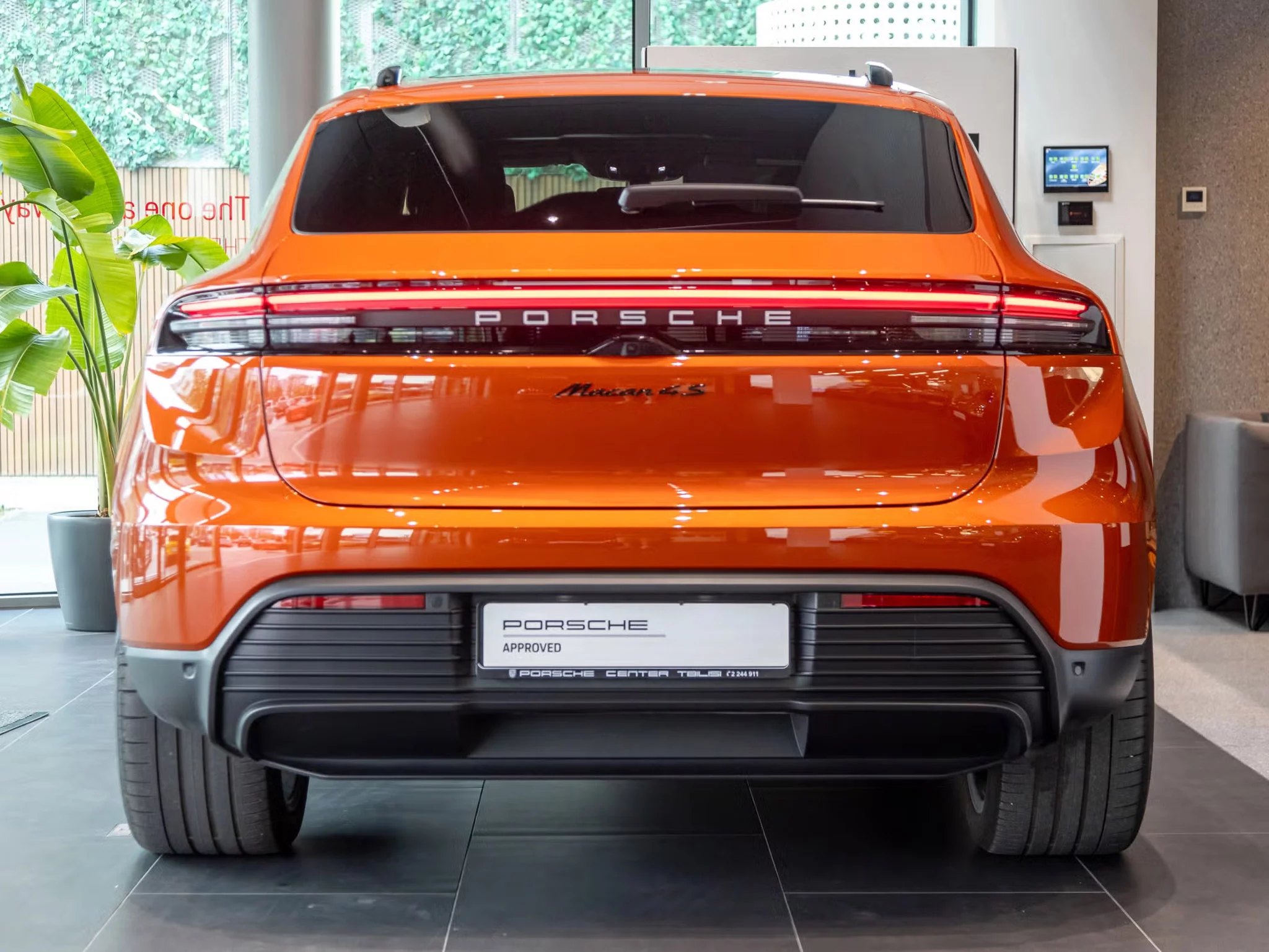 Papaya Metallic Porsche Macan Electric